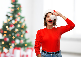 Image showing happy young woman in santa hat on christmas