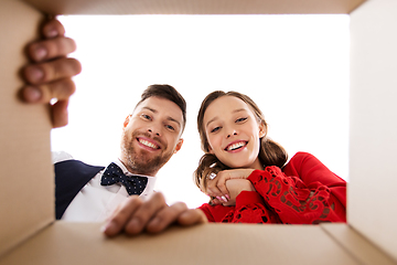 Image showing happy couple looking into open christmas gift box