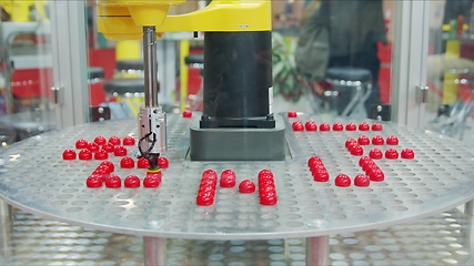 Image showing Automated robotic equipment at work