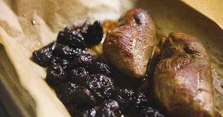 Image showing Roast duck breast with plums prepared motion footage closeup