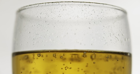 Image showing Glass of beer on the table slow motion footage