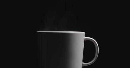 Image showing Vapor rising from hot mug closeup footage