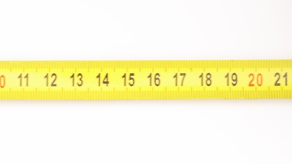 Image showing Extending measuring tape on white background