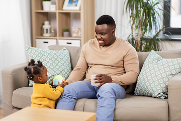 Image showing happy african american father with baby at home