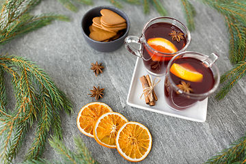Image showing mulled wine, orange slices, gingerbread and spices