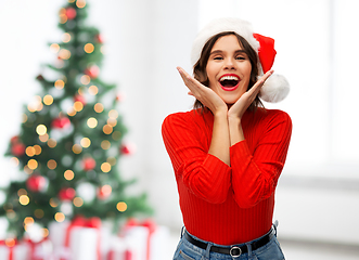 Image showing happy young woman in santa hat on christmas