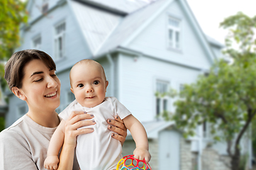 Image showing happy young mother holding little baby daughter