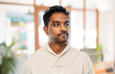 Image showing indian man in sweater over office background