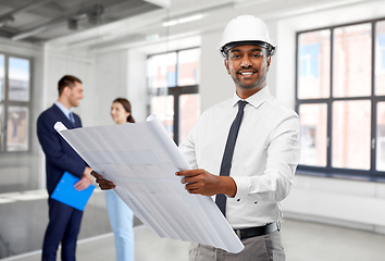 Image showing indian male architect with blueprint at office