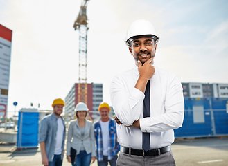 Image showing indian architect in helmet over construction site