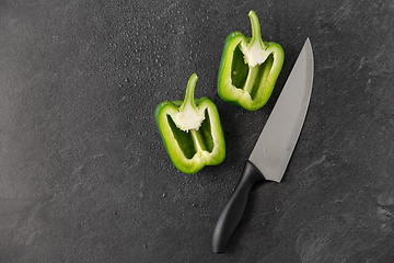 Image showing green pepper and kitchen knife on slate background