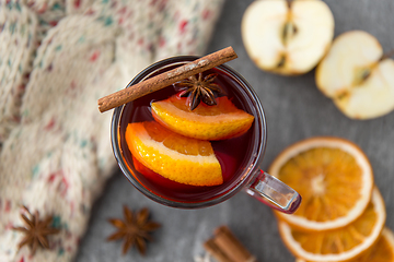 Image showing glass of hot mulled wine with orange and cinnamon