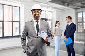 Image showing indian male architect in helmet with blueprints