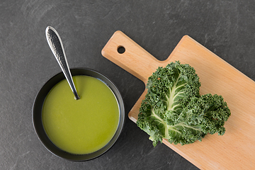 Image showing kale cabbage cream soup in bowl with spoon
