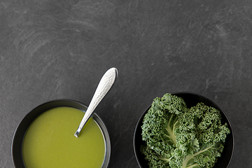 Image showing kale cabbage cream soup in bowl with spoon