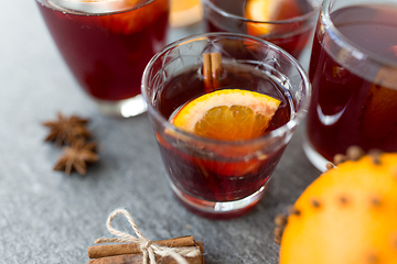 Image showing glasses of mulled wine with orange and cinnamon