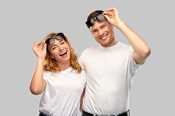 Image showing happy couple in white t-shirts and sunglasses