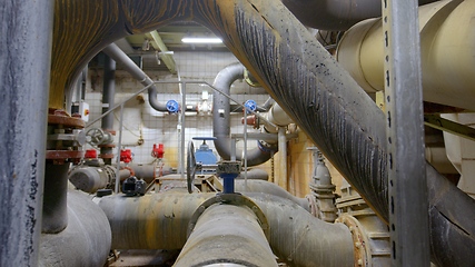 Image showing Boiler room full of pipes sliding movement motion