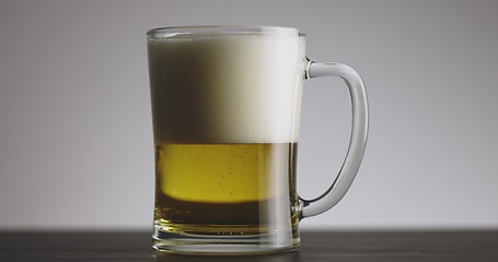 Image showing Large mug of beer on the table slow motion footage