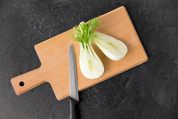 Image showing fennel and kitchen knife on wooden cutting board