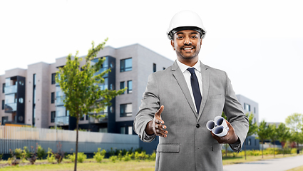 Image showing architect giving hand for handshake on city street