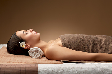 Image showing young woman lying at spa or massage parlor