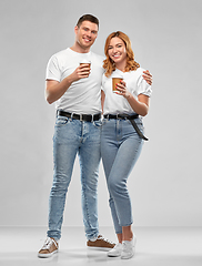 Image showing portrait of happy couple with takeaway coffee cups