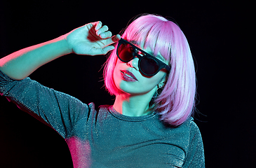 Image showing happy woman in pink wig and black sunglasses