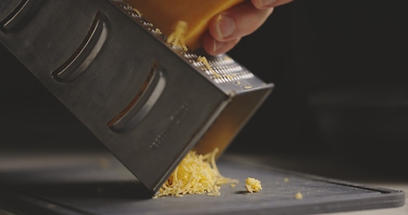 Image showing Grating cheddar cheese in natural light 120 fps slow motion footage