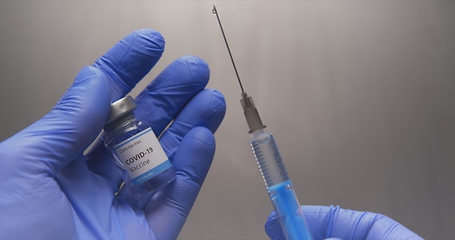 Image showing Vaccine in human hands closeup footage