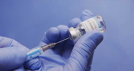 Image showing Vaccine in human hands closeup footage