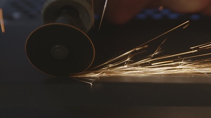 Image showing Steel cutter with sparks while cutting steel bar