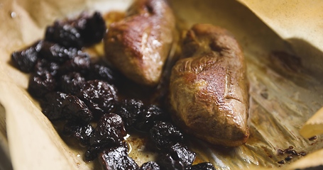 Image showing Roast duck breast with plums prepared motion footage