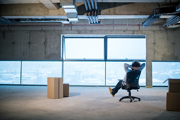 Image showing young business man taking a break on construction site