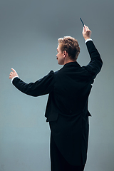 Image showing Contemporary ballroom dancer on grey studio background