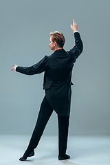 Image showing Contemporary ballroom dancer on grey studio background