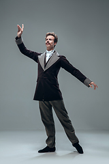 Image showing Contemporary ballroom dancer on grey studio background