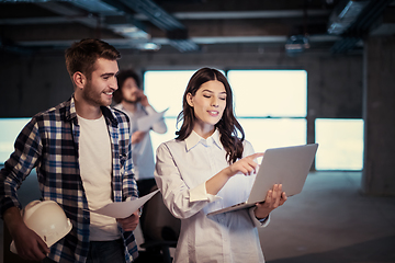 Image showing business people in group, architect and engineer on construction