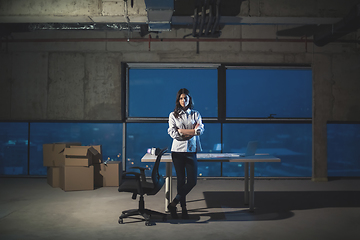 Image showing young female architect and engineer on construction site