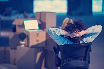 Image showing young business man taking a break on construction site