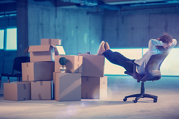 Image showing young business man taking a break on construction site