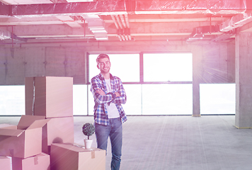 Image showing portrait of young businessman on construction site