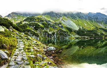 Image showing Tourist hiking trail along the picturesque mountain lake