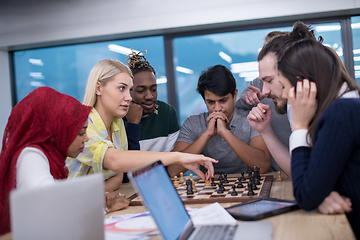 Image showing multiethnic group of business people playing chess