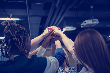 Image showing multiethnic Group of young business people celebrating success