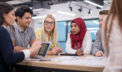 Image showing Multiethnic startup business team having meeting