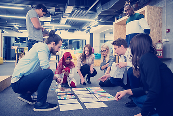 Image showing black muslim woman having meeting with Multiethnic  startup busi