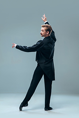 Image showing Contemporary ballroom dancer on grey studio background