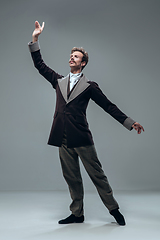 Image showing Contemporary ballroom dancer on grey studio background