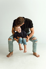 Image showing Happy father holding adorable little son and smiling